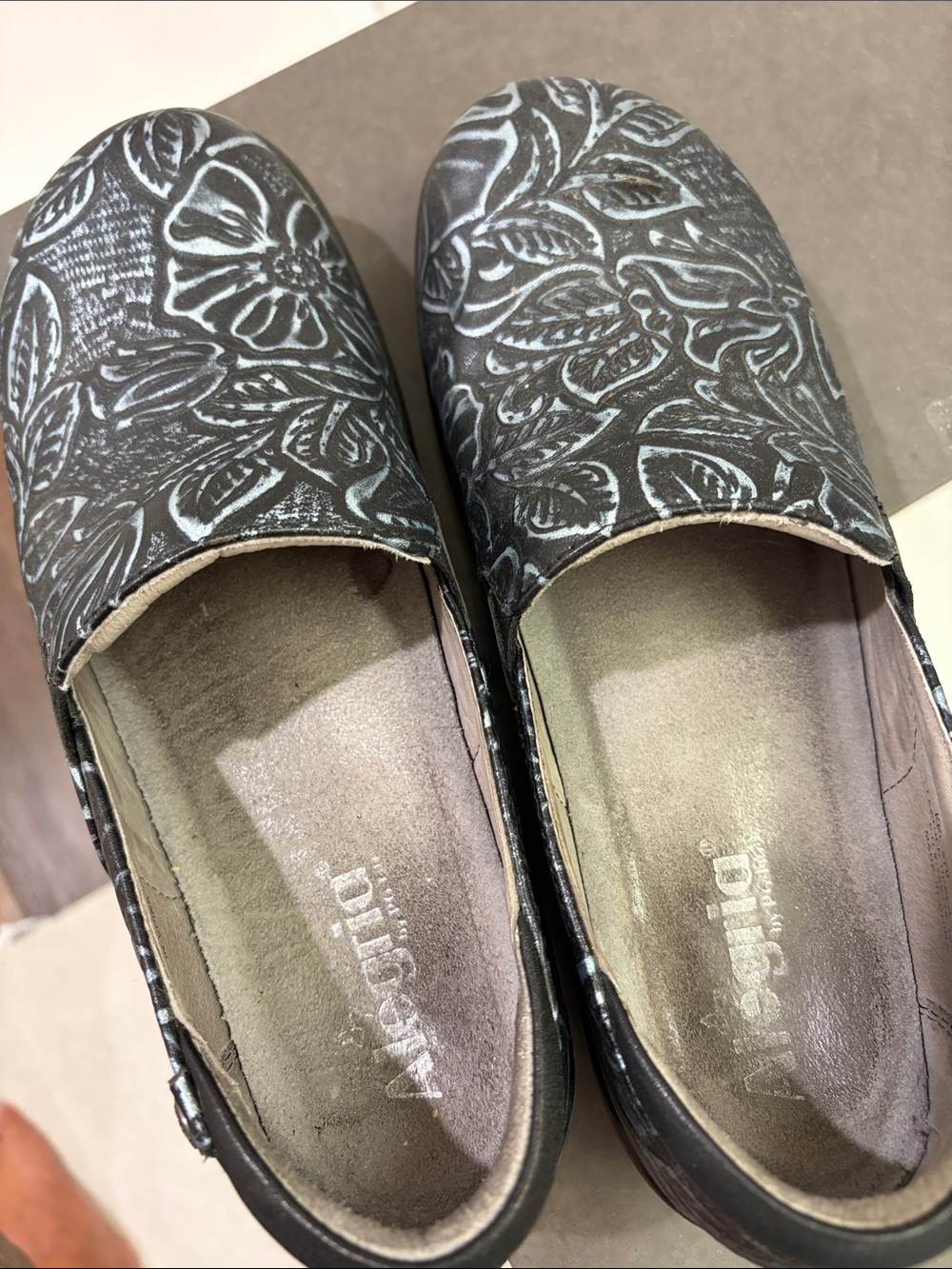 Dansko Black Floral-Print Slip-On Clogs with Light Blue Accents